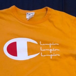Mustard yellow/orangish champion medium tee